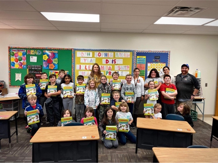 rotary members and 3rd grade students  with dictionaries